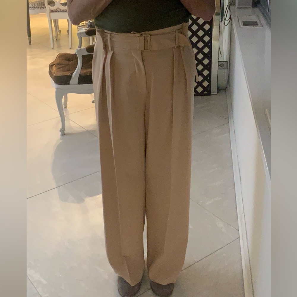 VINCE Pair of belted and front pleat slacks with belt.